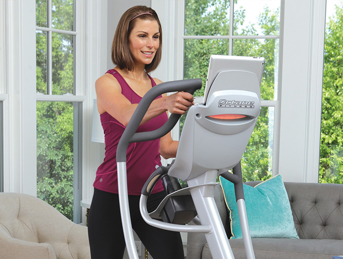 Woman working out on an Octane elliptical