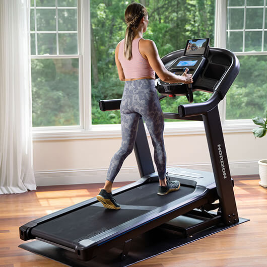 Woman walking on Horizon treadmill